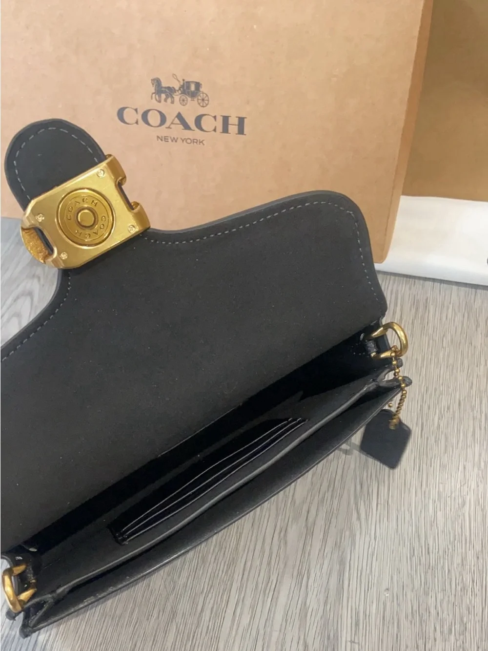 Coach Black Leather Crossbody with Gold 'C' Hardware and Chain Strap